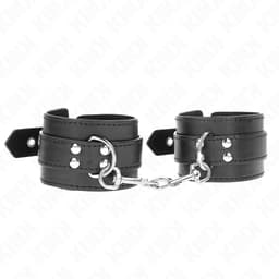 Kink Handgelenkfesseln, einer Nietenreihe im Detail, Handgelenkfesseln der Kink BDSM-Serie im Karton
