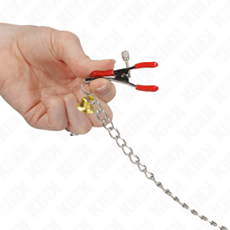 Kette der Kink Bell Klemmen ausgelegt, 30 cm Länge im Größenvergleich
