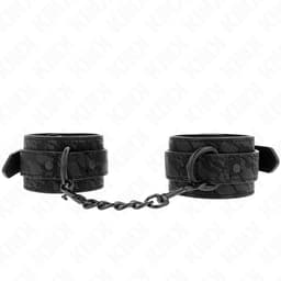 Kink Handgelenkmanschetten mit Spitzenbezug von der Seite fotografiert, Spitzenstruktur und Verschluss im Detail
