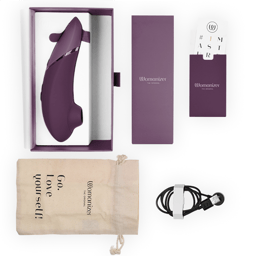 Womanizer Next Klitorisstimulator mit 3D Pleasure Air in Dunkellila, mit magnetischem USB-Ladekabel an den Ladekontakten